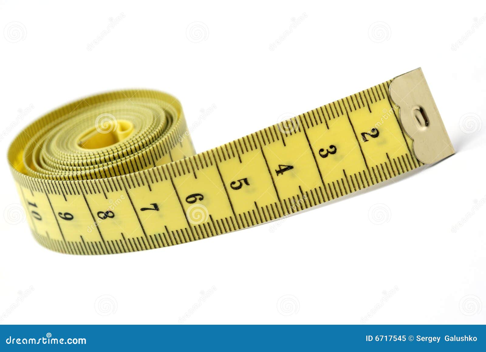 Yellow measuring tape curls on a white background isolated. Tailor's sewing  cloth measuring tool. Ruler for body measuring. Stock Photo