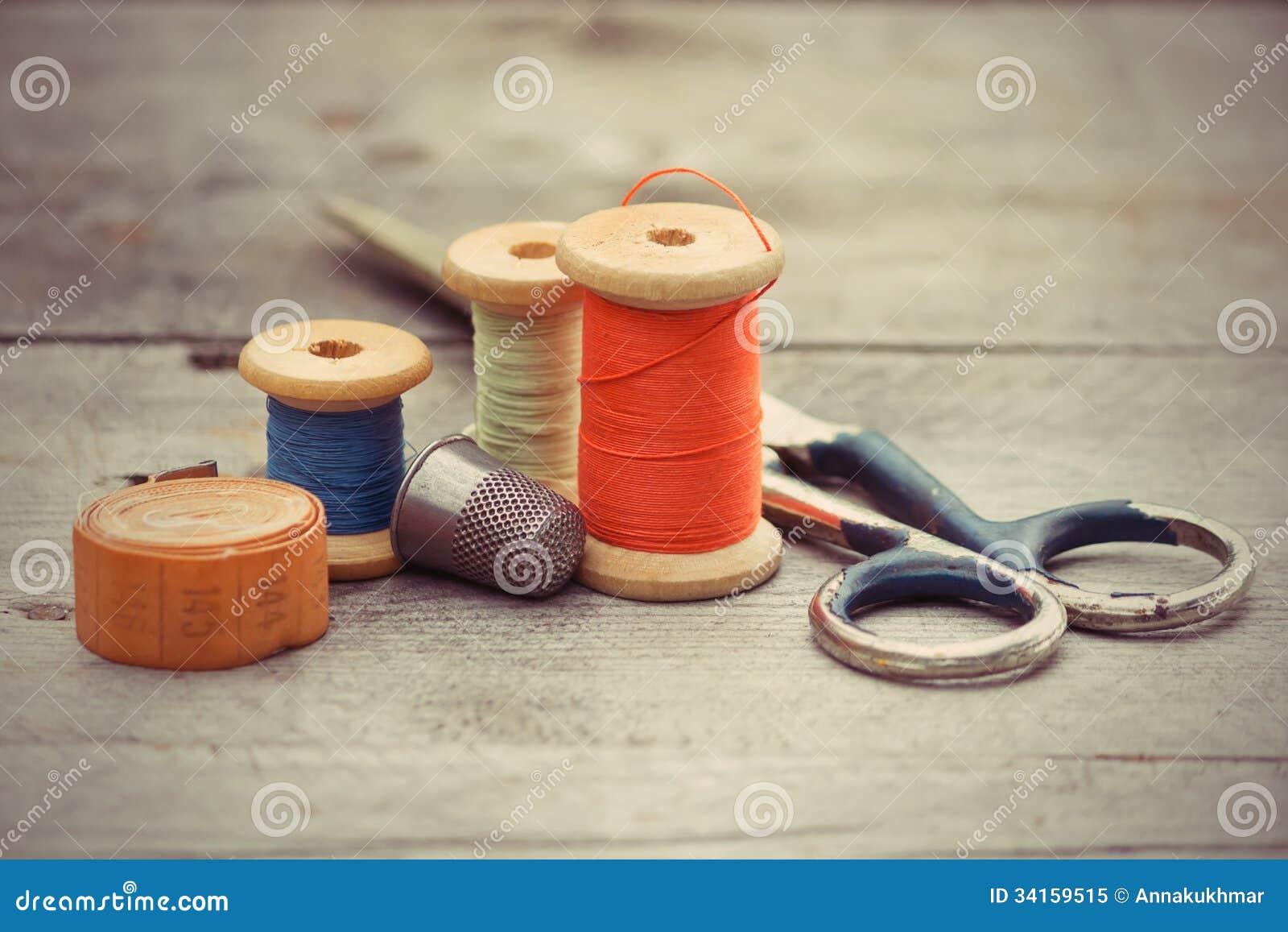 Old Metal Scissors, Tailor Tape Measure And Metal Thimble On Fabric Stock  Photo, Picture and Royalty Free Image. Image 19120436.