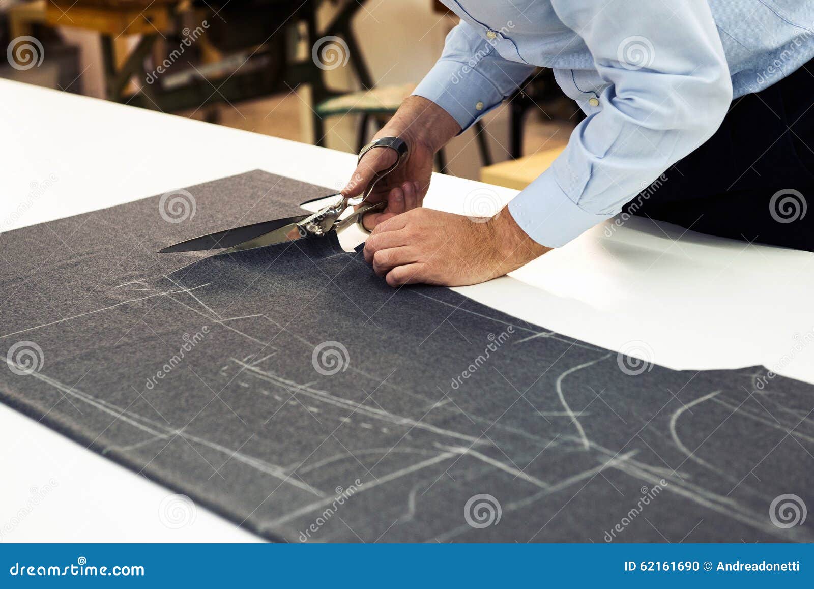 Tailor Working in His Shop Cutting Fabric Stock Photo - Image of