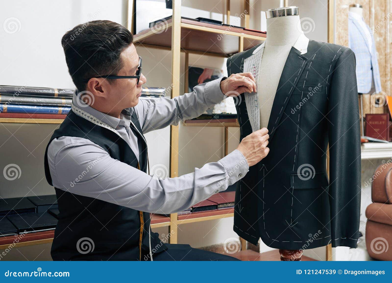 Tailor working on jacket stock image. Image of lapel - 121247539