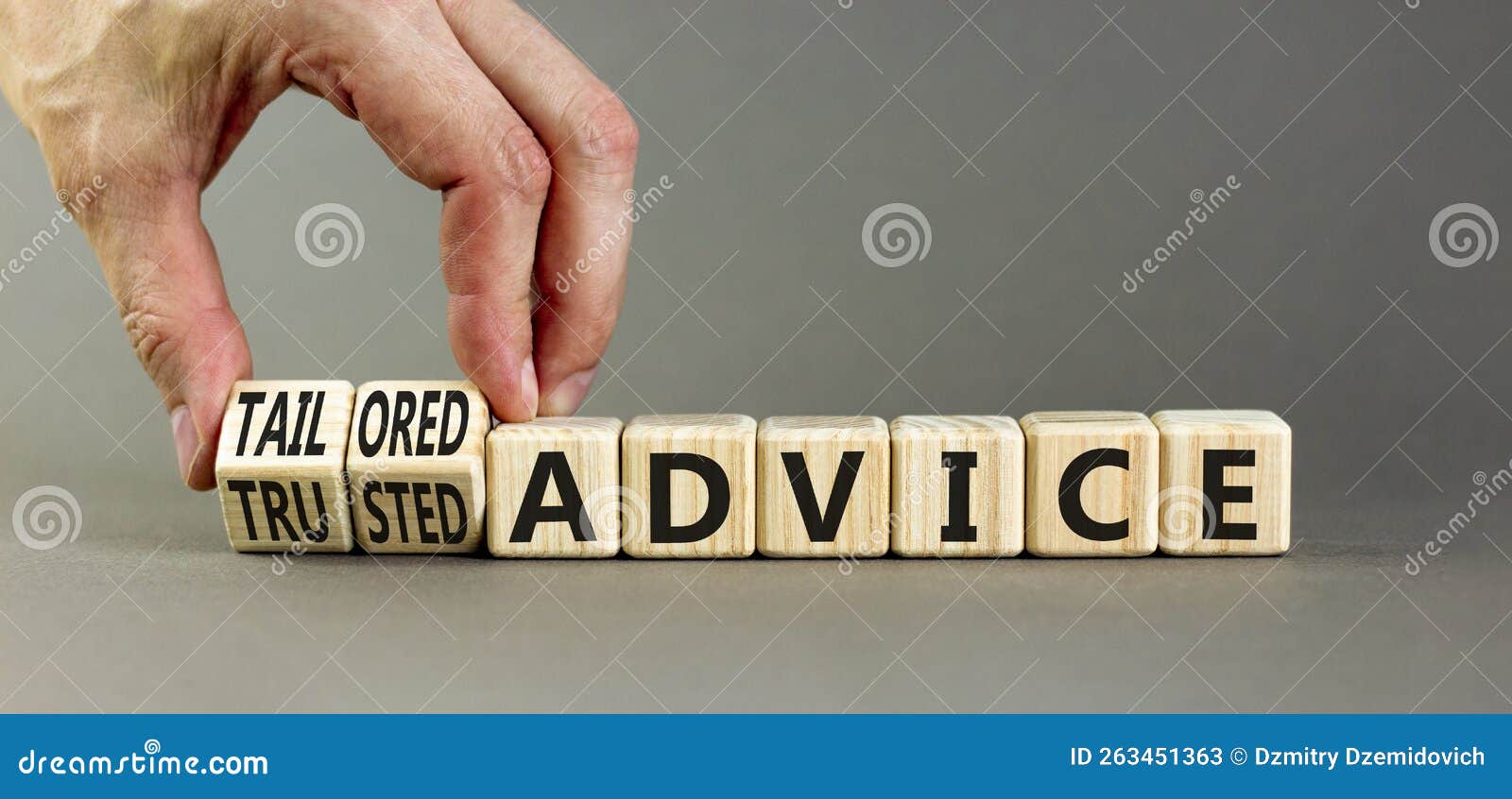 tailored or trusted advice . concept words tailored advice and trusted advice on wooden cubes. businessman hand. beautiful