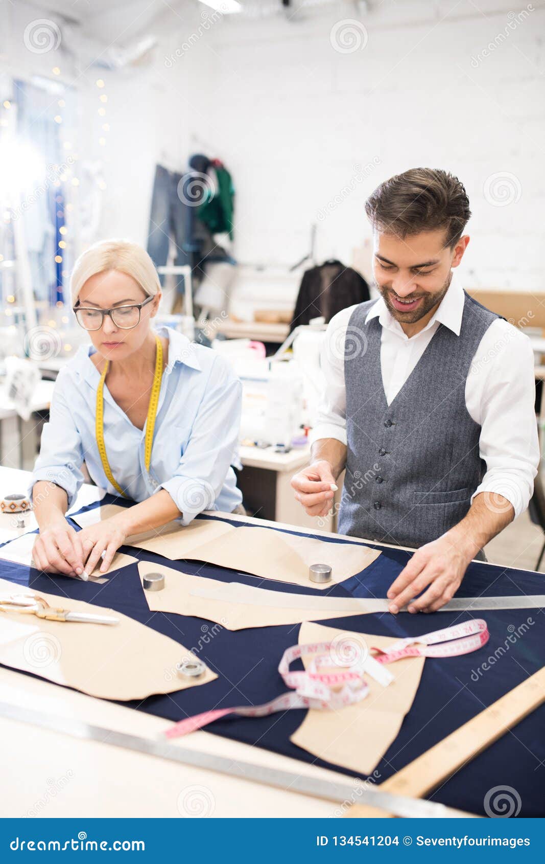 Tailors Working at Table in Atelier Stock Photo - Image of creative ...