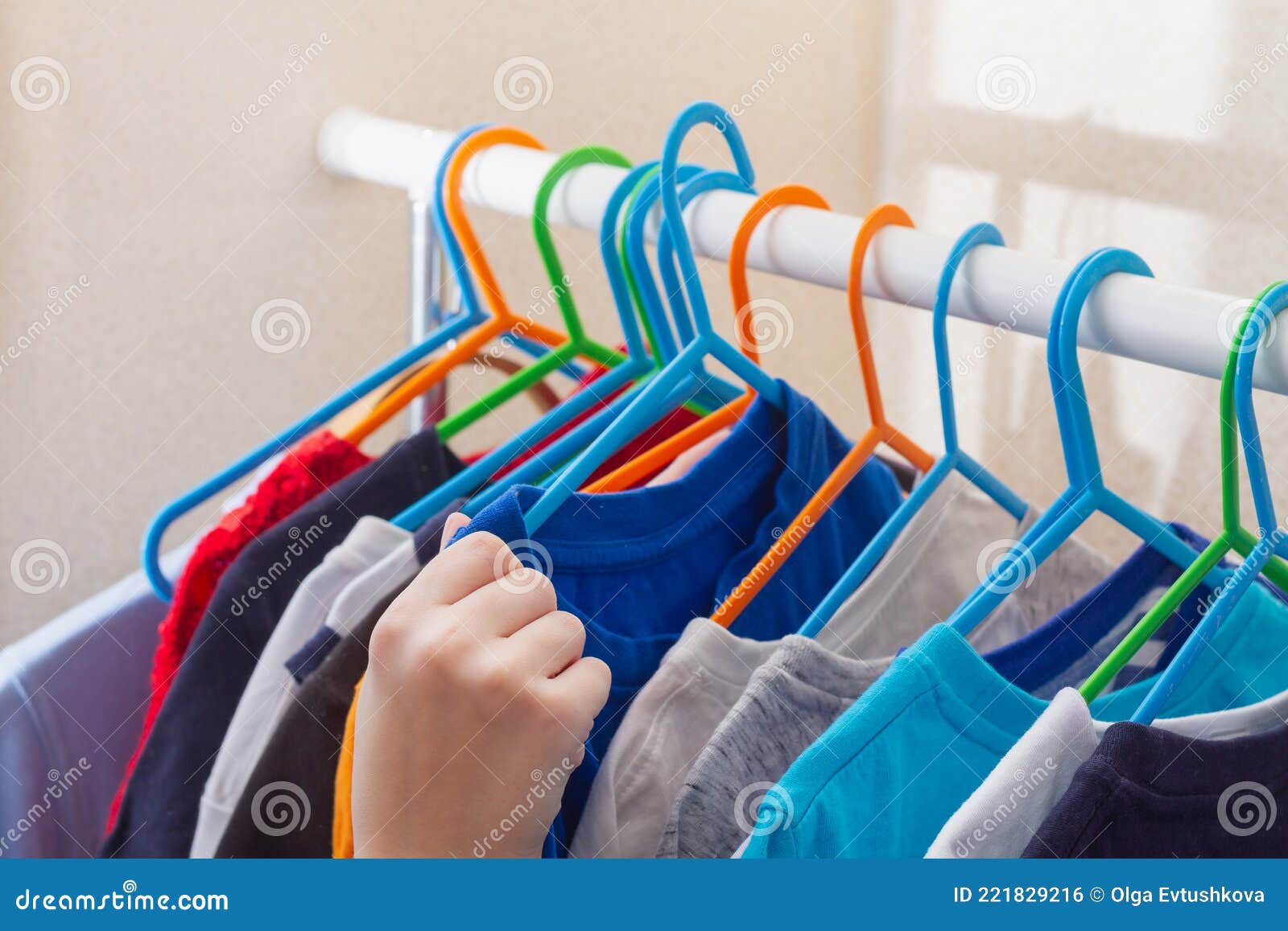 Take Clothes from Hangers at Home from the Wardrobe Stock Photo Image