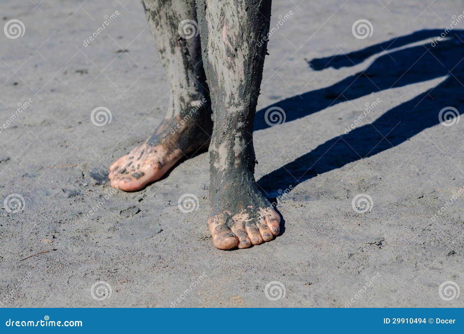 Take a Mud Cure. Healthy Medical Procedure. Dirty Legs Stock Photo