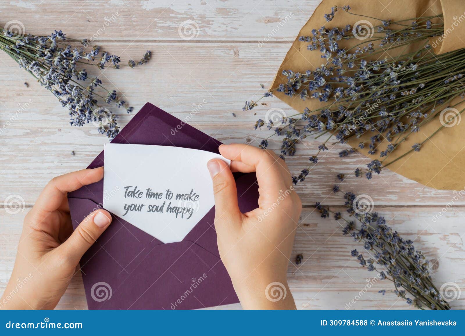 take time to make your soul happy text on supportive message paper note reminder from green envelope. flat lay