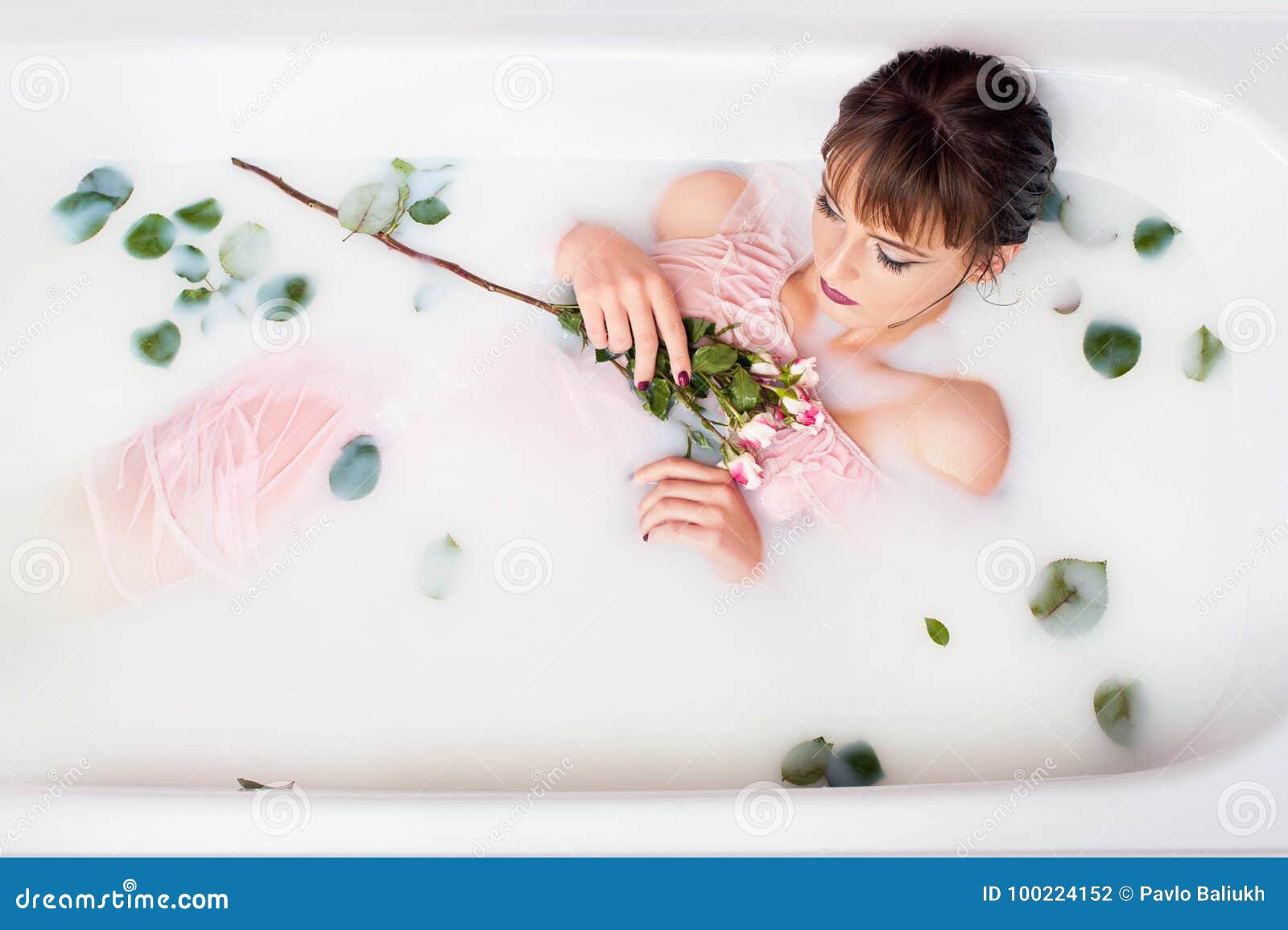 Woman relaxing in bath with rose petal, Stock Photo, Picture And Low Budget  Royalty Free Image. Pic. ESY-006768167