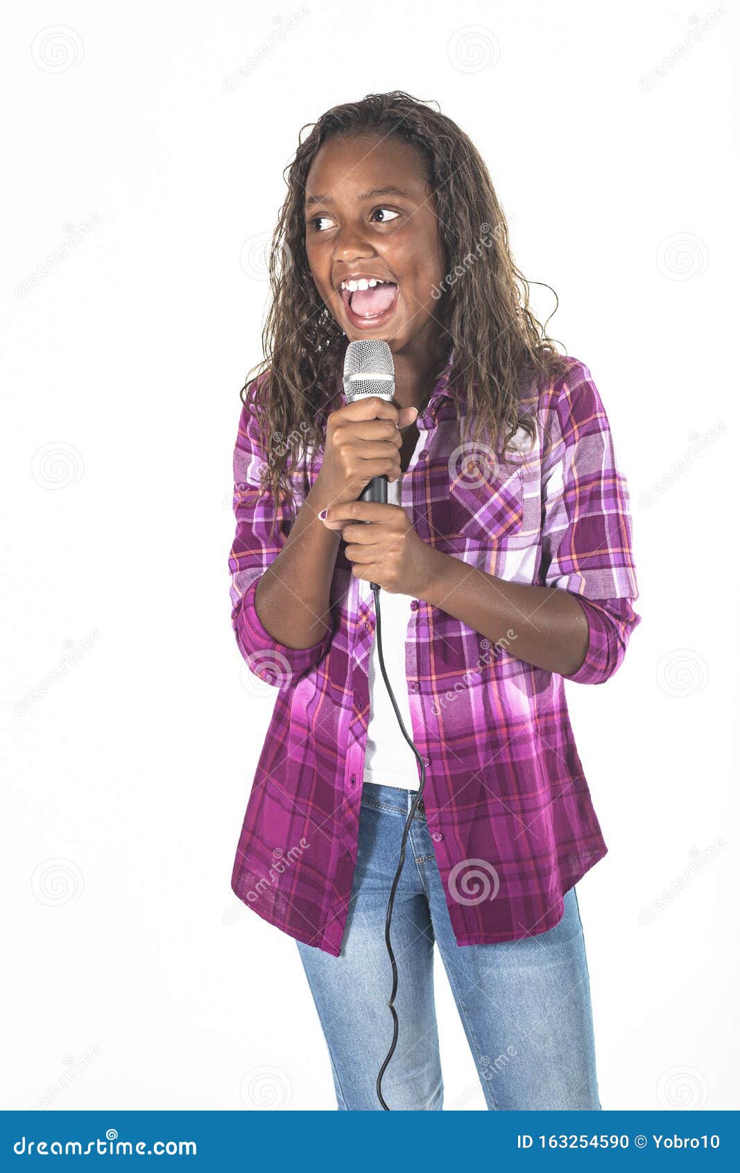talented young diverse singer singing into a microphone