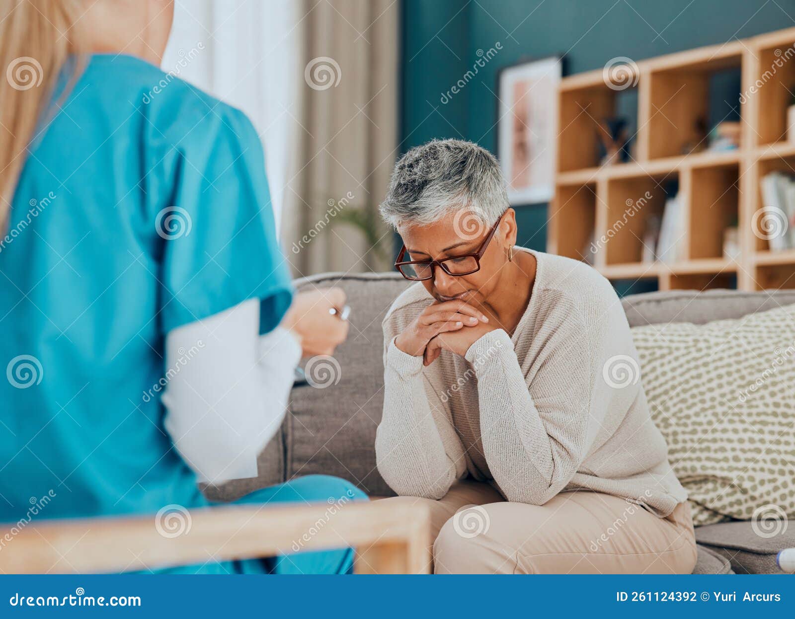 Talking Healthcare And Nurse With Sad Old Woman In Home Sitting On 