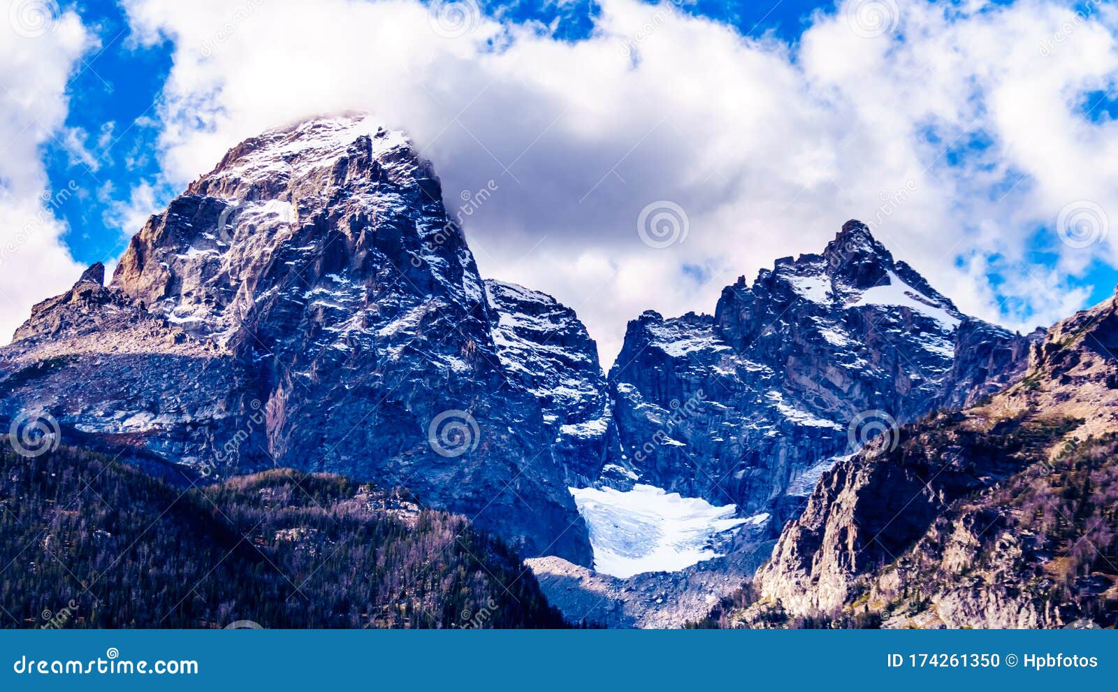 the tall mountain peaks of grand teton 13,770 ft and mount owen 12,928 ft with the teton galcier in the teton range