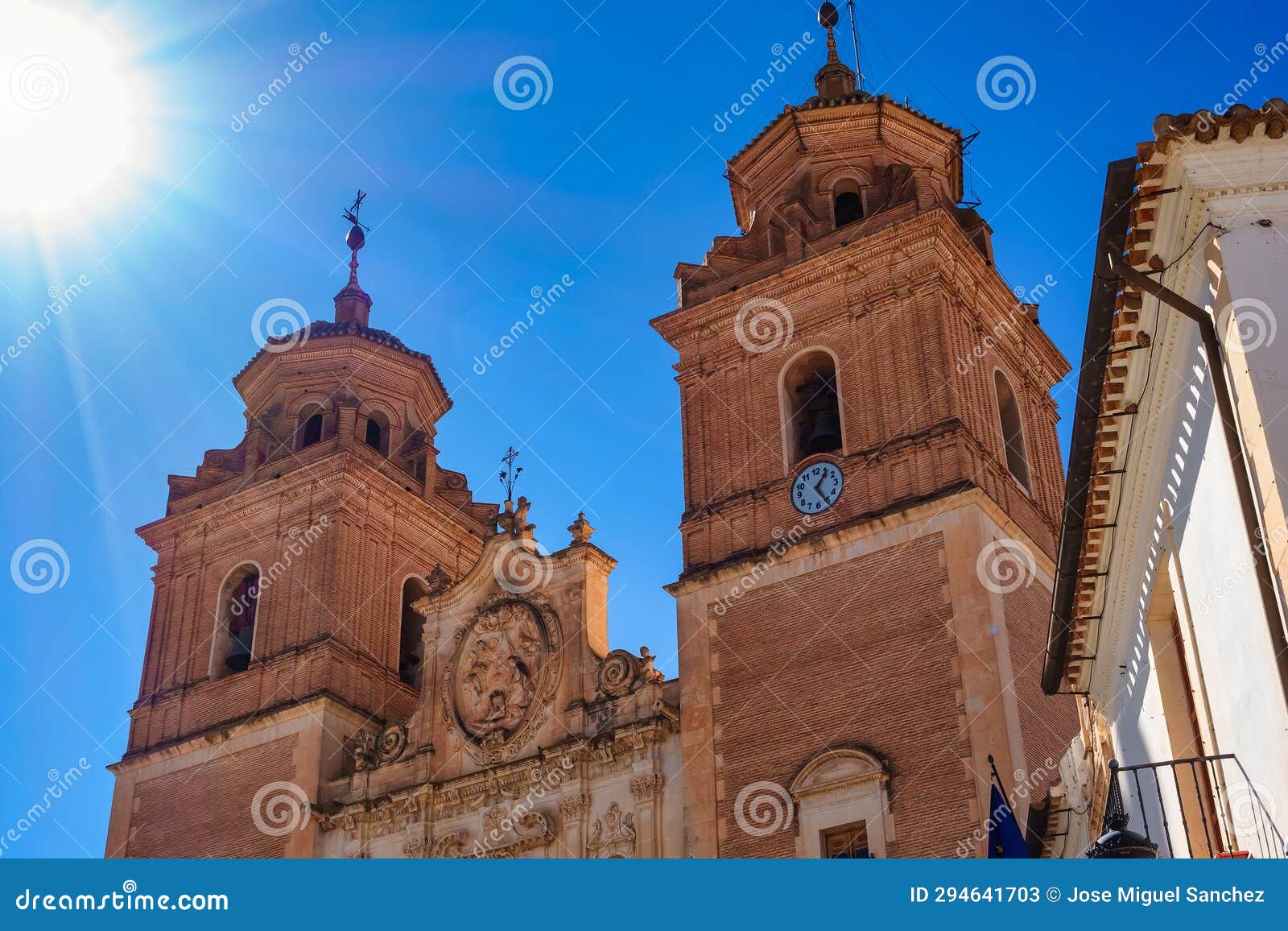 tall towers of the huge church of the immaculate mary in the andalusian village of velez rubio, almeria.