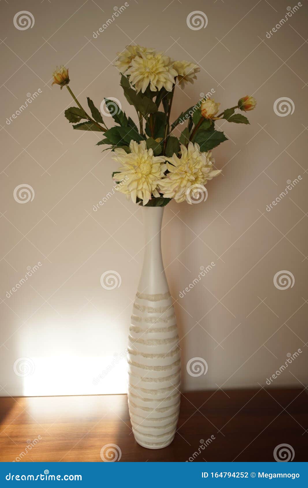 Tall Vase of Flowers on a Table in the Living Room Stock Photo Image