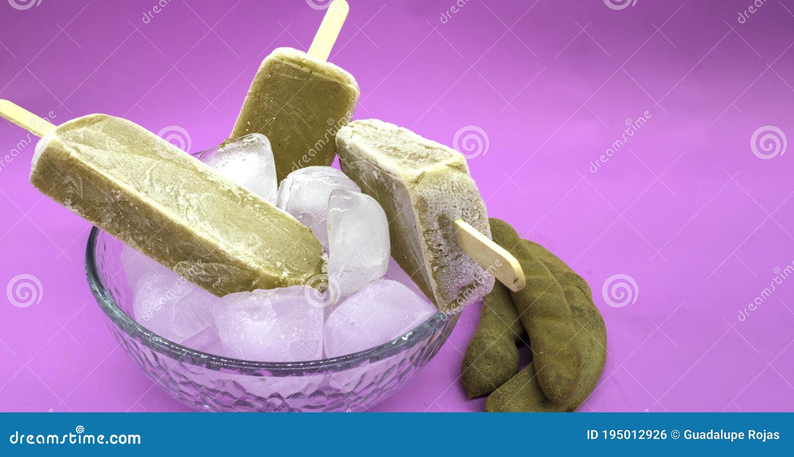 Tamarind Flavored Brown Ice Lollipop Inside A Deep Plate With Ice On A Light Purple Background With Tamarind Pods On The Sides Stock Photo Image Of Flavour Cream Tamarind Flavored Brown Ice Lollipop Inside A Deep Plate With Ice On A Light Purple Background With Tamarind Pods On The Sides Stock Photo Image Of Flavour Cream