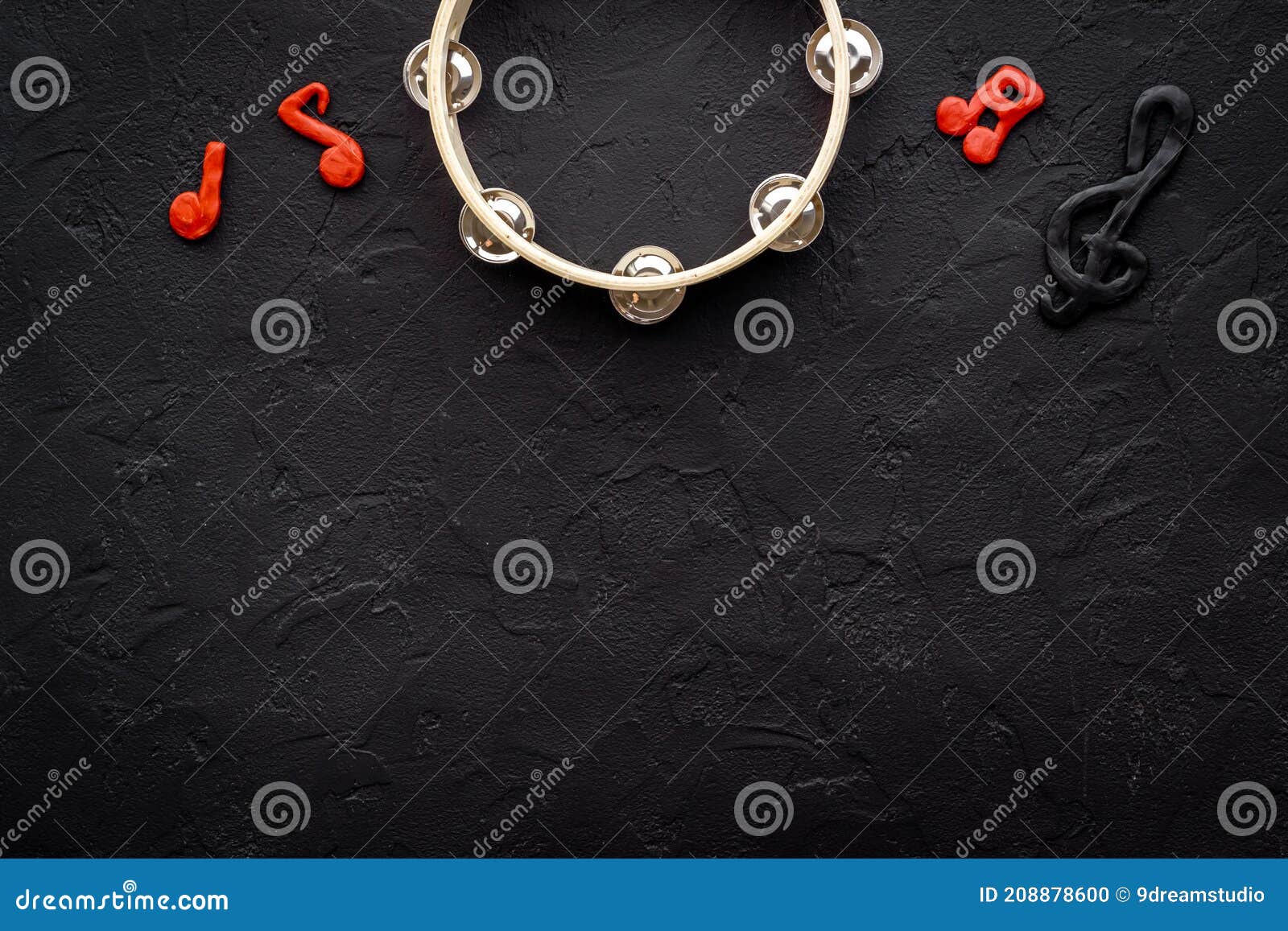 tambourine with music hotes, flat lay, top view