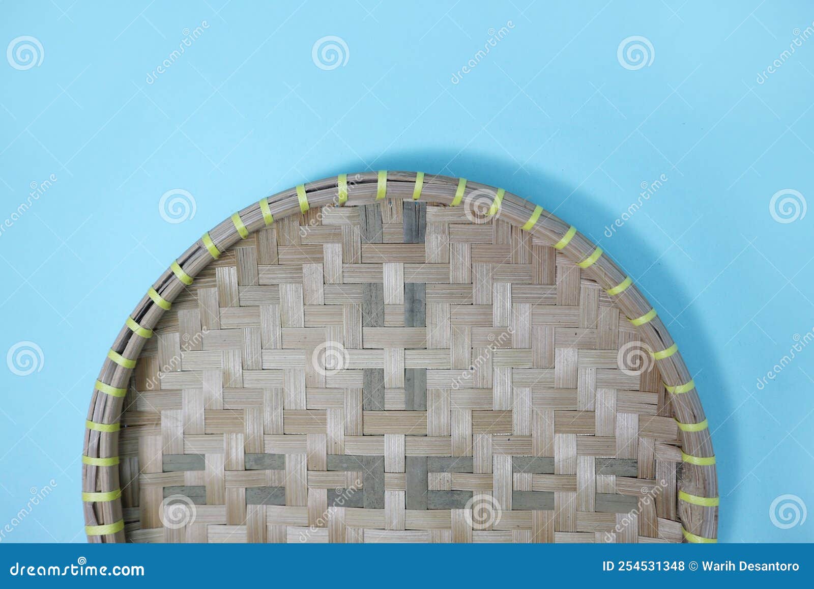A Small Round Bamboo Wall Art or Tampah Bambu, a Typical Indonesian Handicraft. Stock Photo