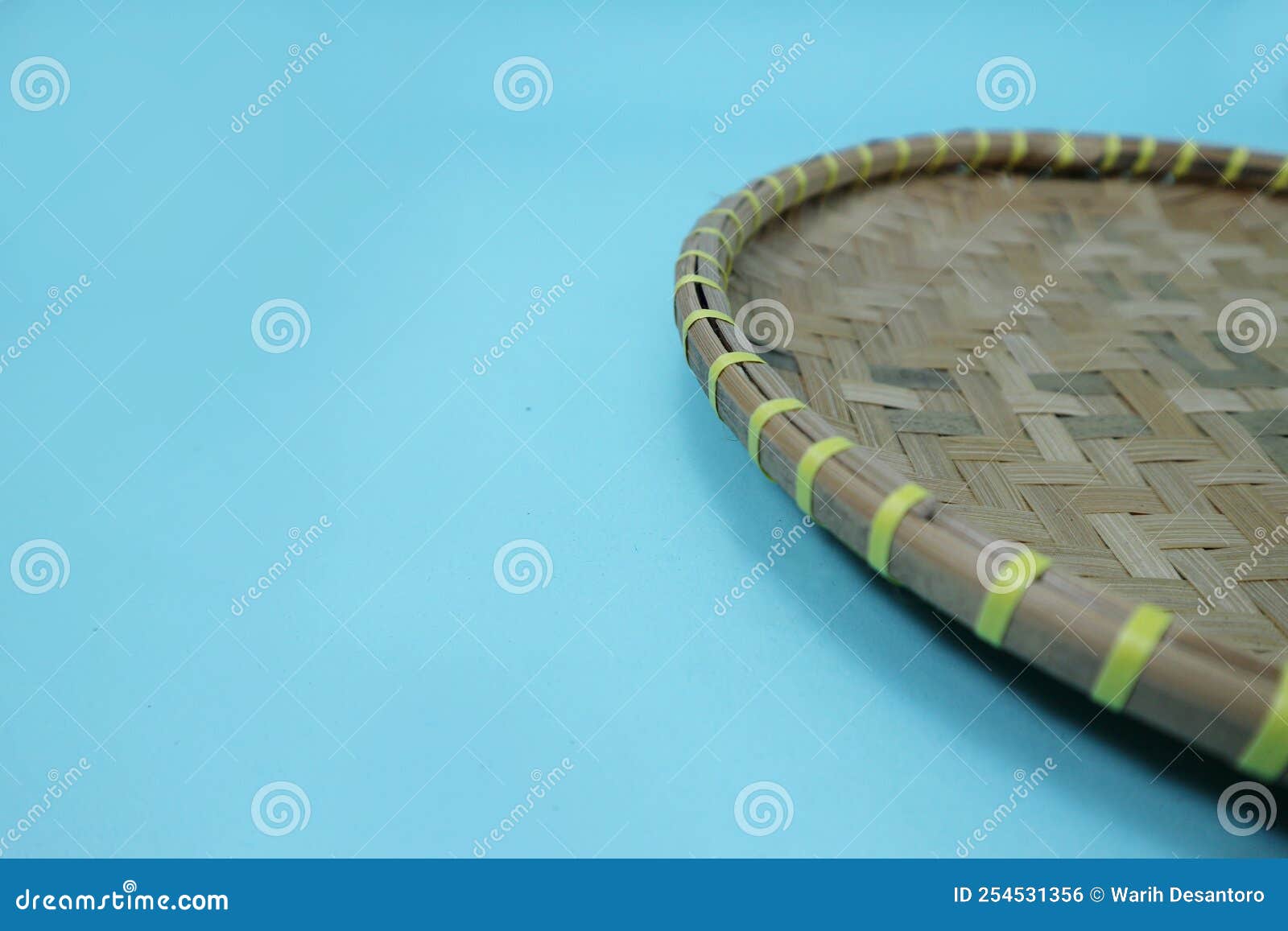 A Small Round Bamboo Wall Art or Tampah Bambu, a Typical Indonesian