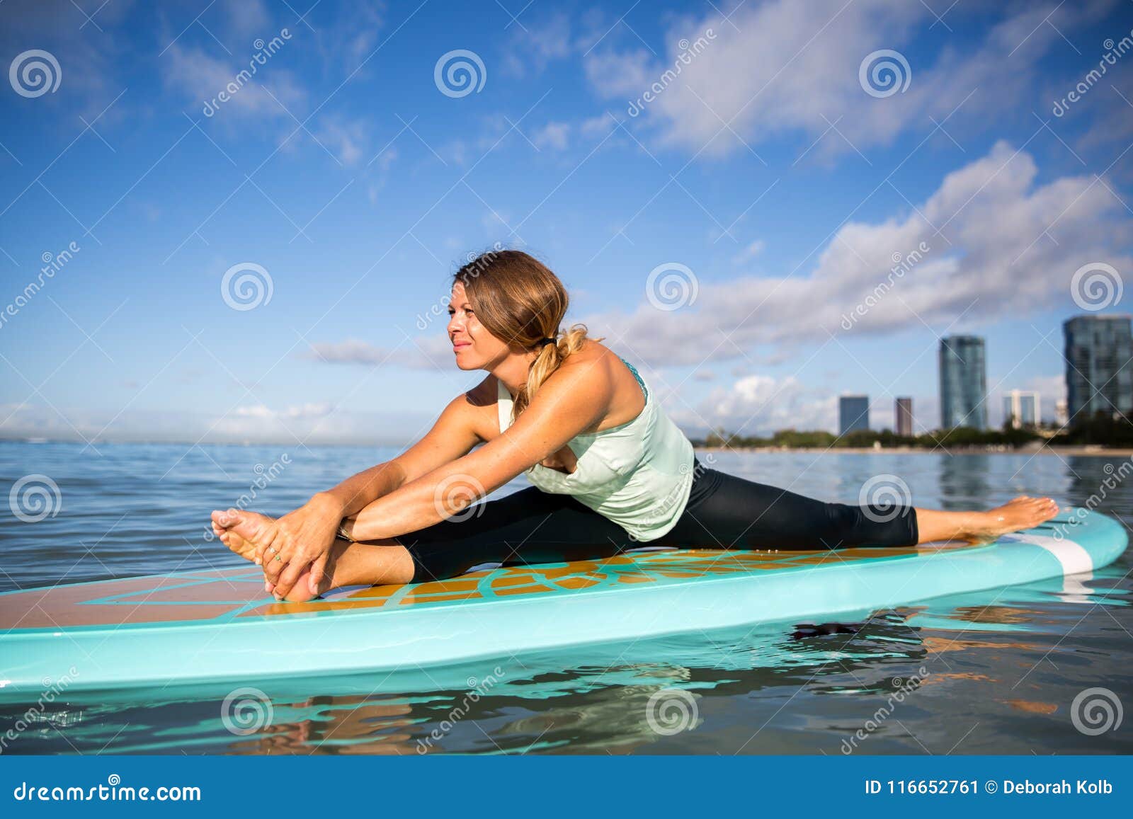 Athletic Young Woman in SUP Yoga Practice Side Bend Pose in Ala Stock ...