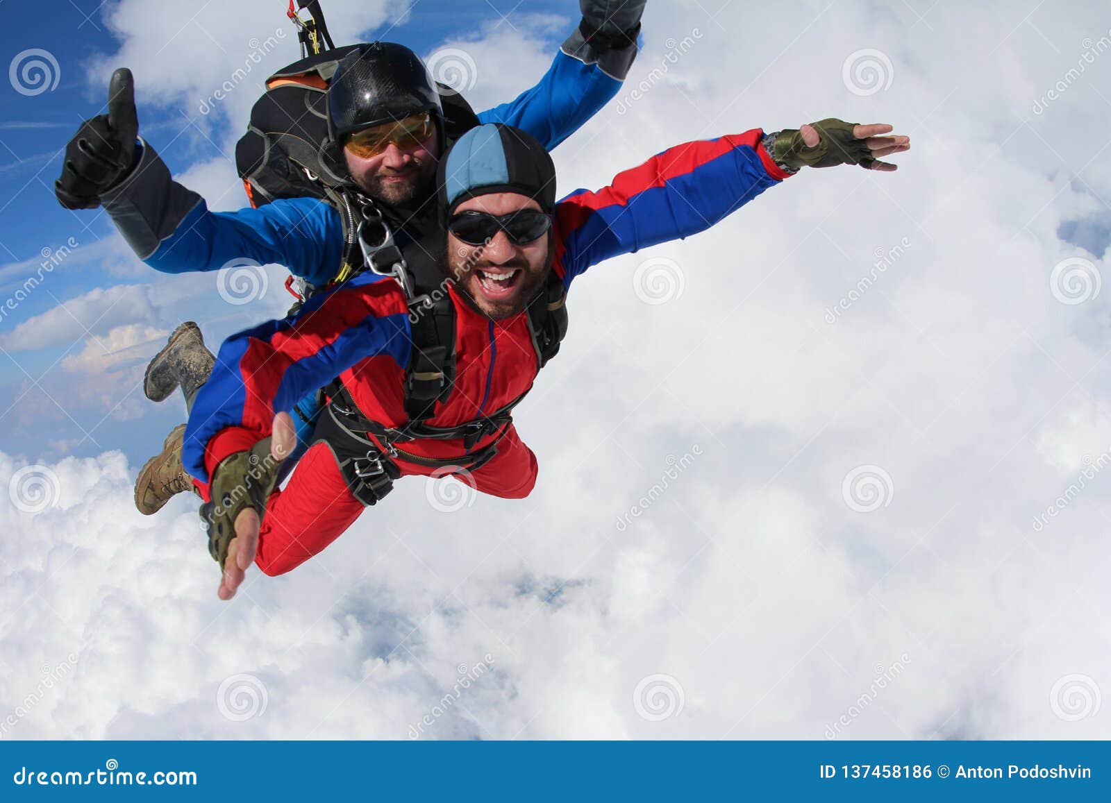 skydiving. tandem is flying in the clouds.