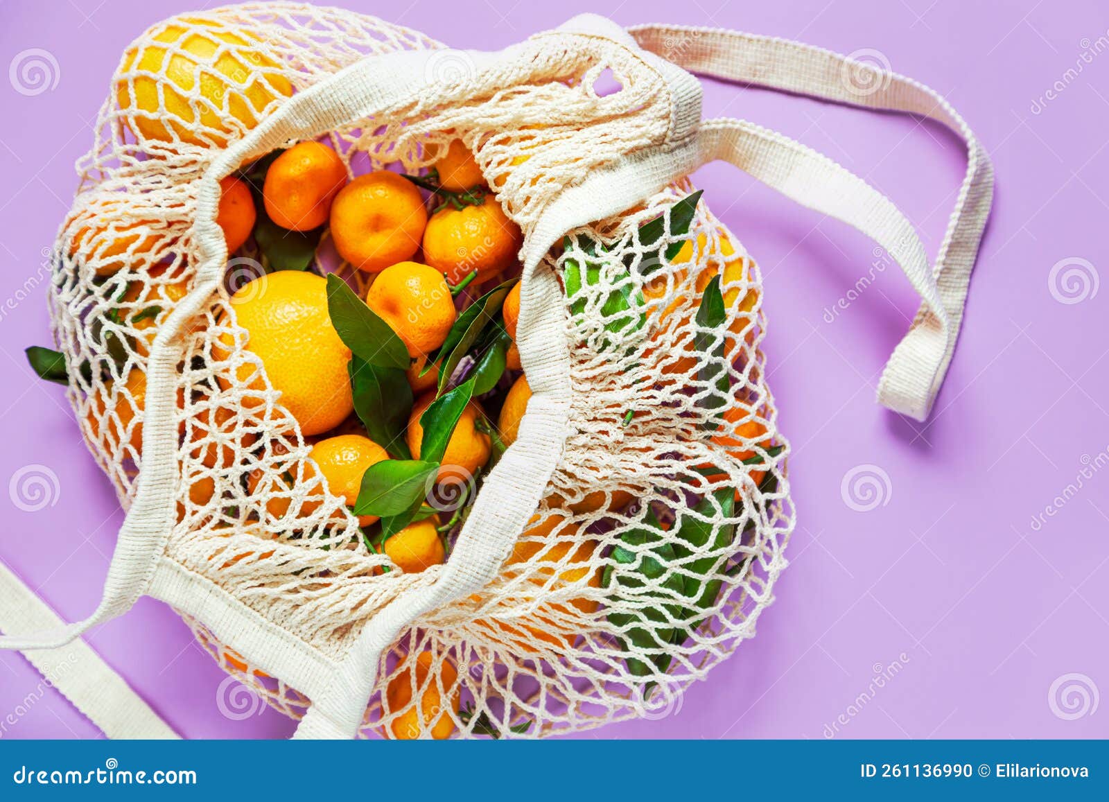 Tangerines in a String Bag on a Lilac Background Stock Photo Image of