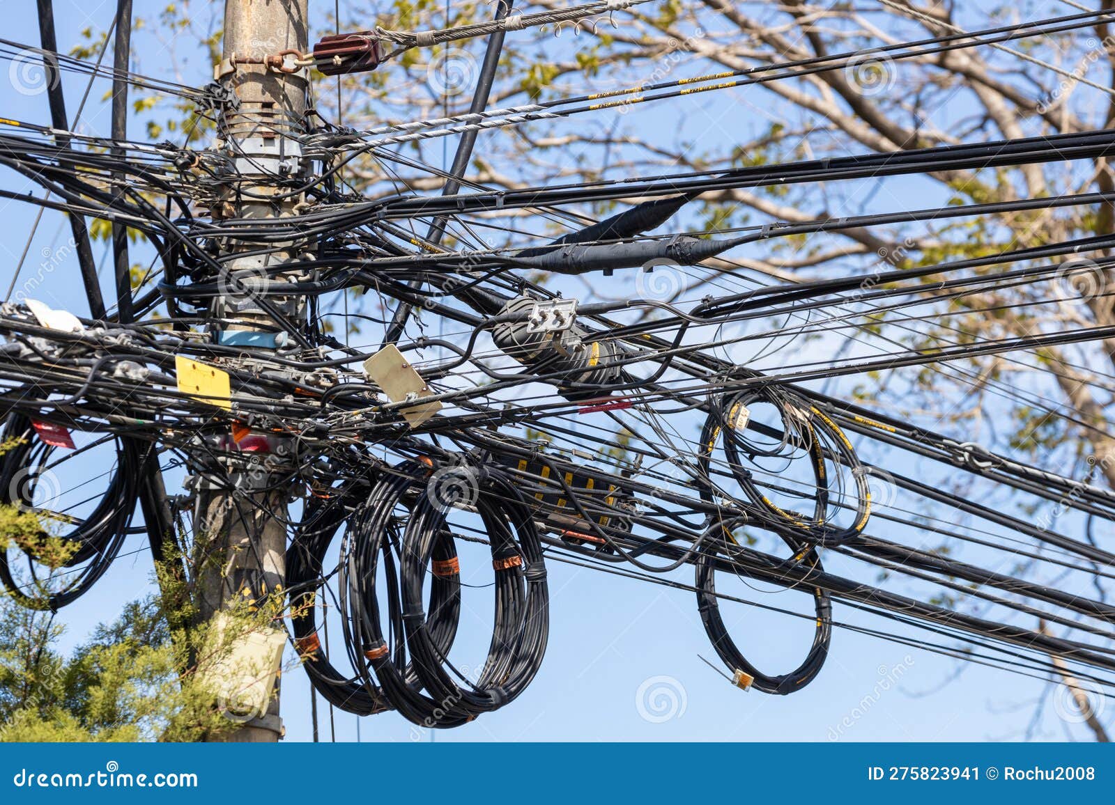A Tangle of Electrical Wires and Cables on a City