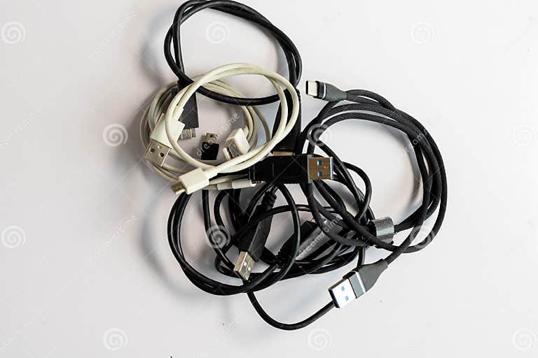 Tangled Charging Cables and Wires for Electrical Devices Stock Photo