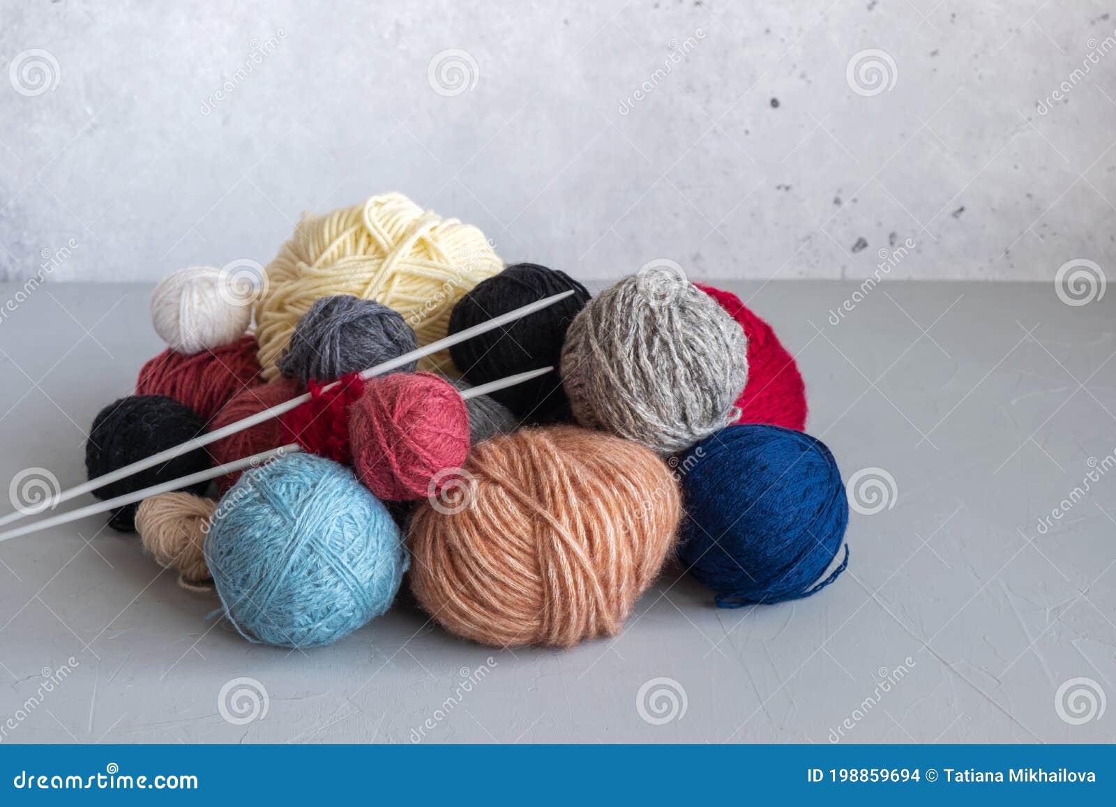 Tangles Of Wool Threads Of Different Colors And Knitting Needles On A Gray Background Stock Photo Image Of House Handmade 198859694