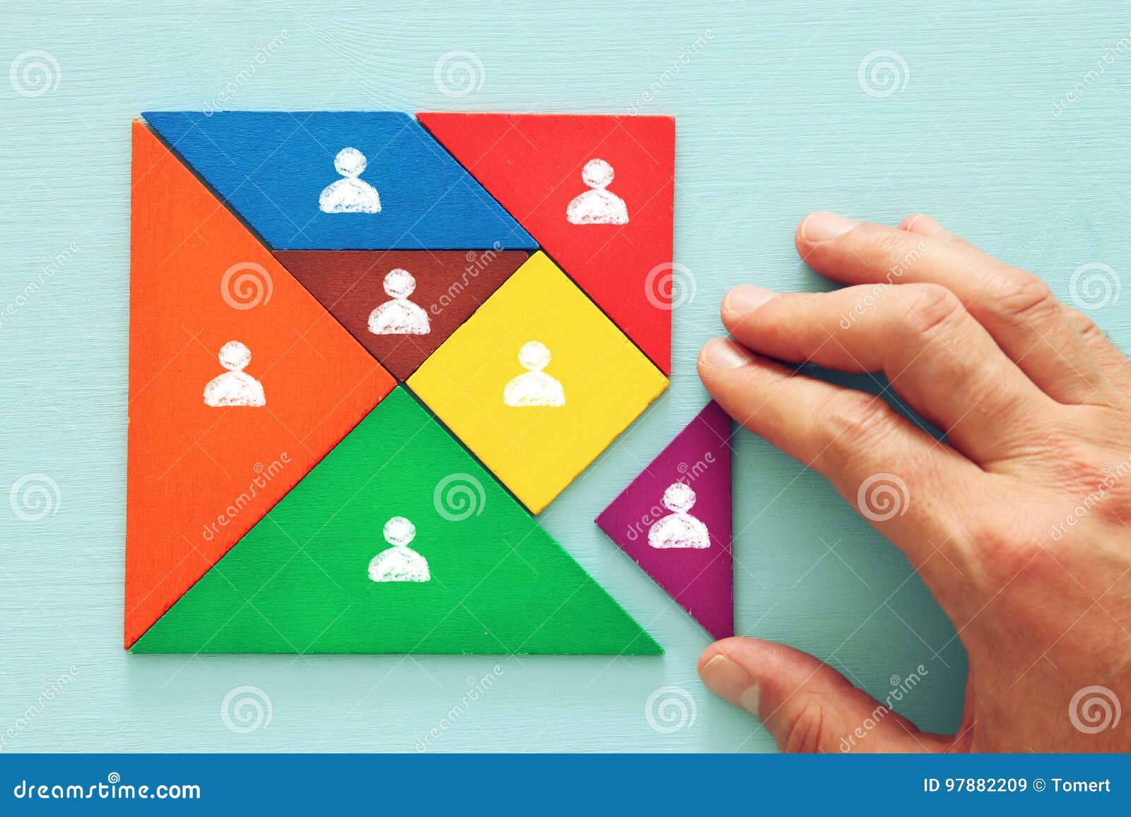 tangram puzzle blocks with people icons ,human resources and management concept.