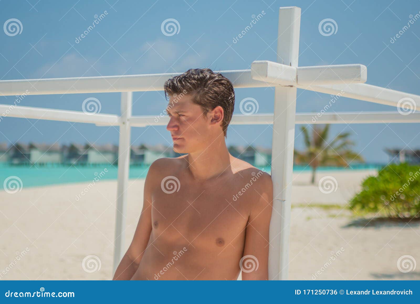 Tanned Attractive Man Near Ocean in Swimming Wear at Tropical Beach at ...