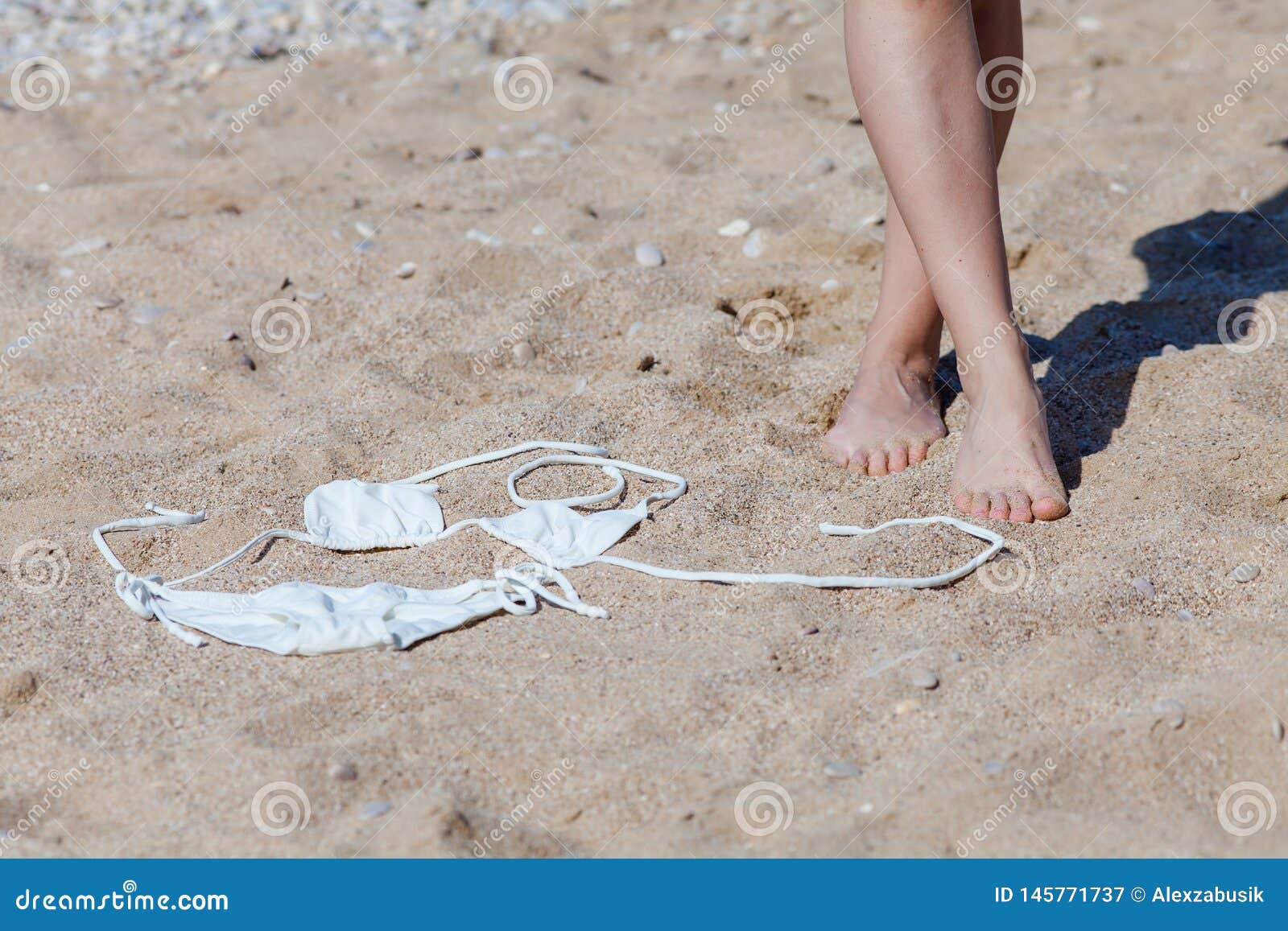Tanned Feet of Woman and White Bikini on Sand Stock Image - Image of ...