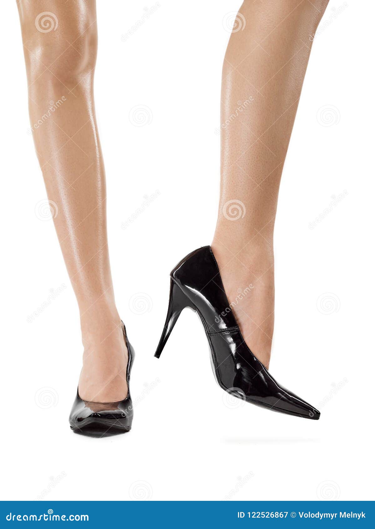 Foot pain woman taking off shoes after work day tired coming home removing  high heels relaxing in sofa for the weekend. Luxury hotel room relax  getaway. Feet health problem businesswoman Stock Photo