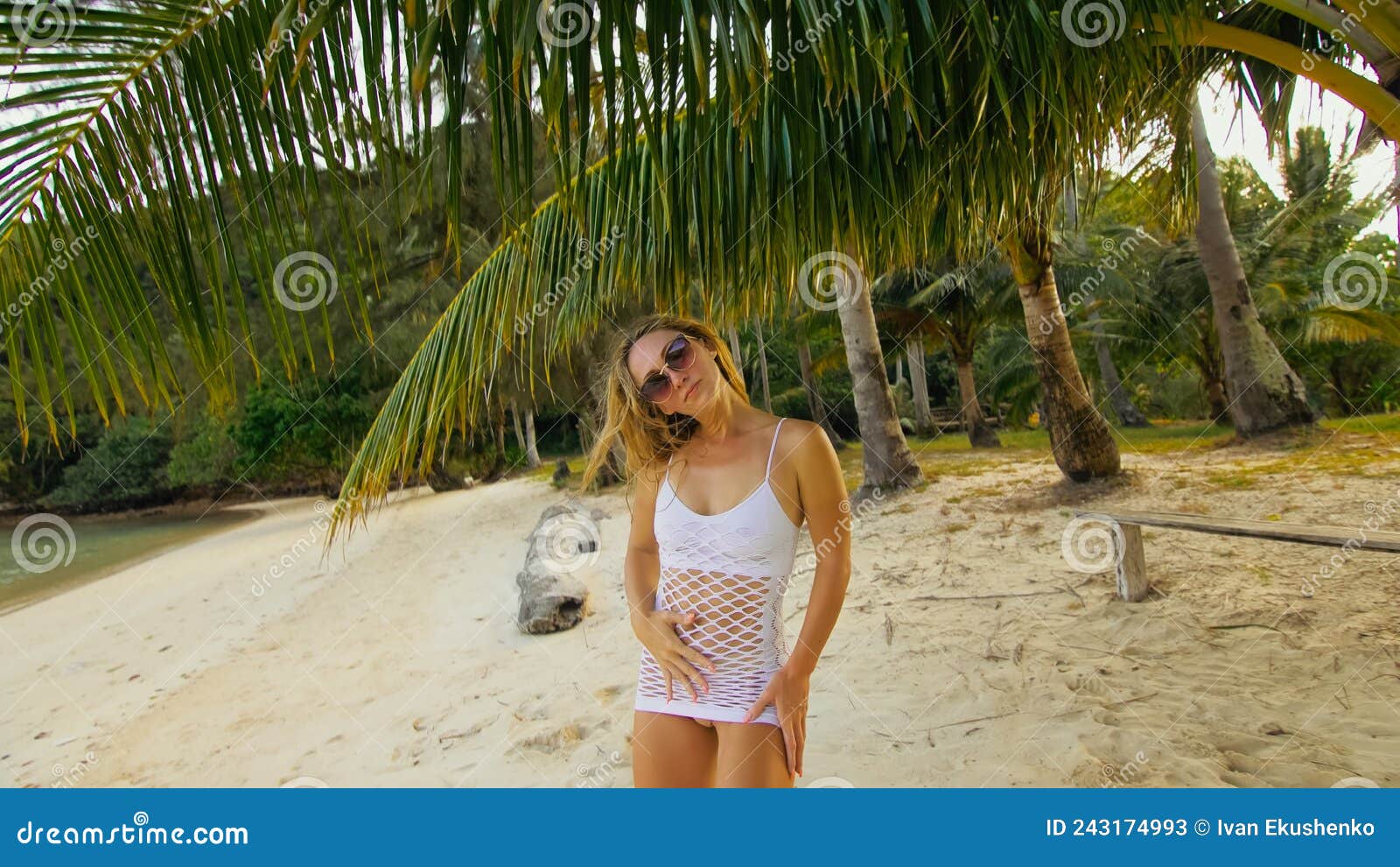 Ladies with appetizing breasts have a good time on the beach