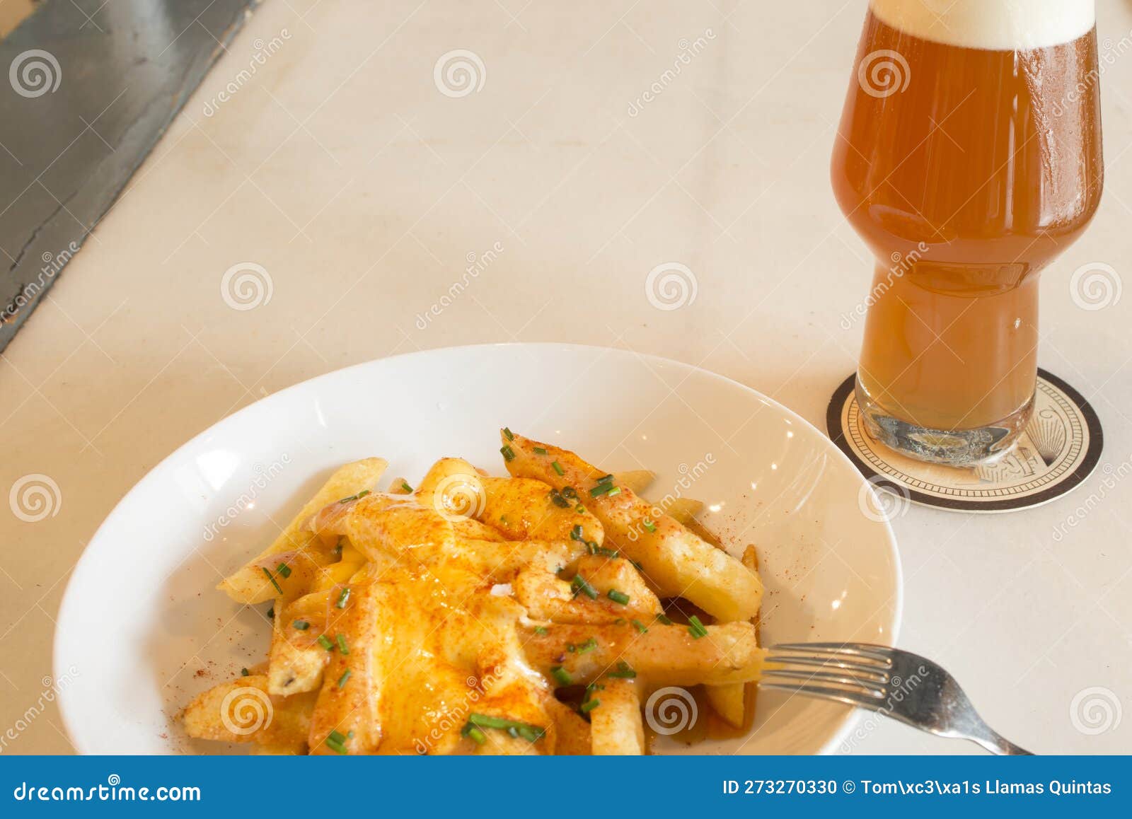 A Tapa of Chips with Cheese and Paprika when Ordering a Beer I Stock