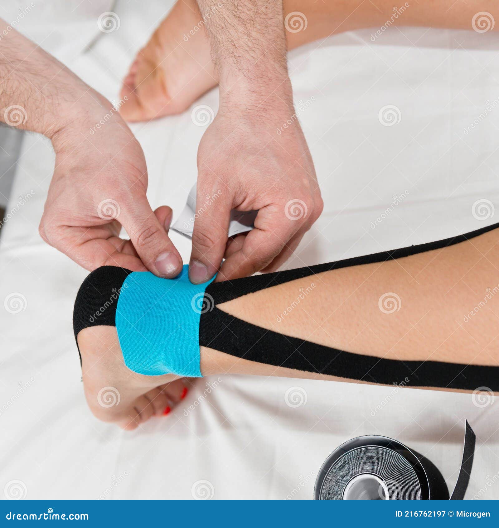 Therapist Using Tape on Sprained Ankle Stock Image Image of care, healthcare 216762197