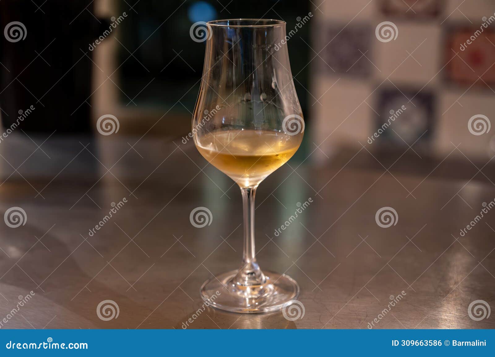 tasting of cognac spirit aged in old french oak barrels in cellar in distillery in cognac white wine region, charente, segonzac,