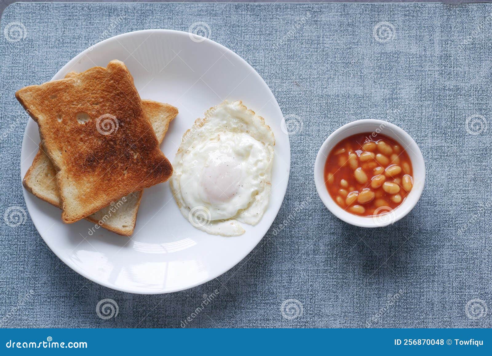 Tasty Baked Beans, Egg and Bread for Morning Break Fast Stock Photo