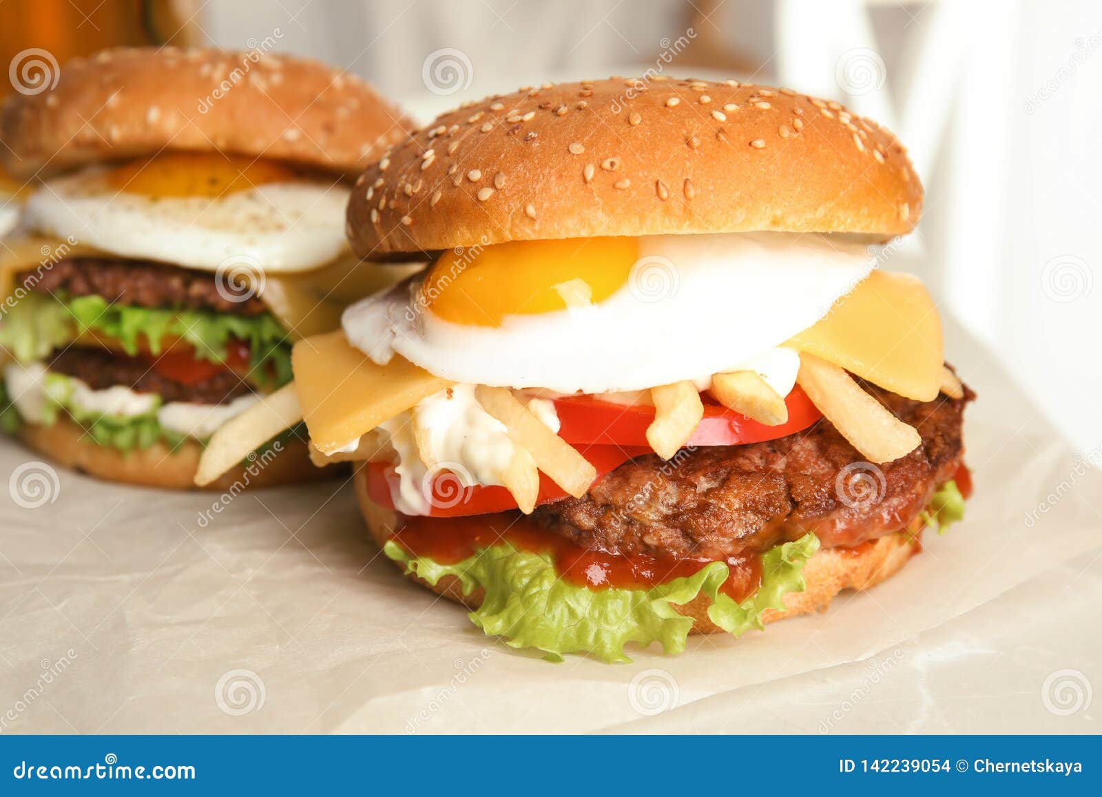 Tasty Burgers with Fried Egg Stock Photo - Image of bread, beef: 142239054