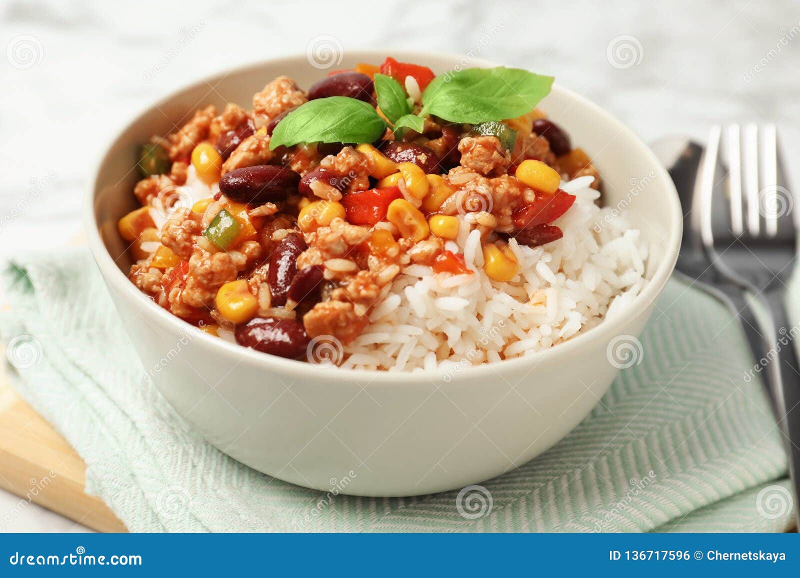 tasty chili con carne served with rice in bowl