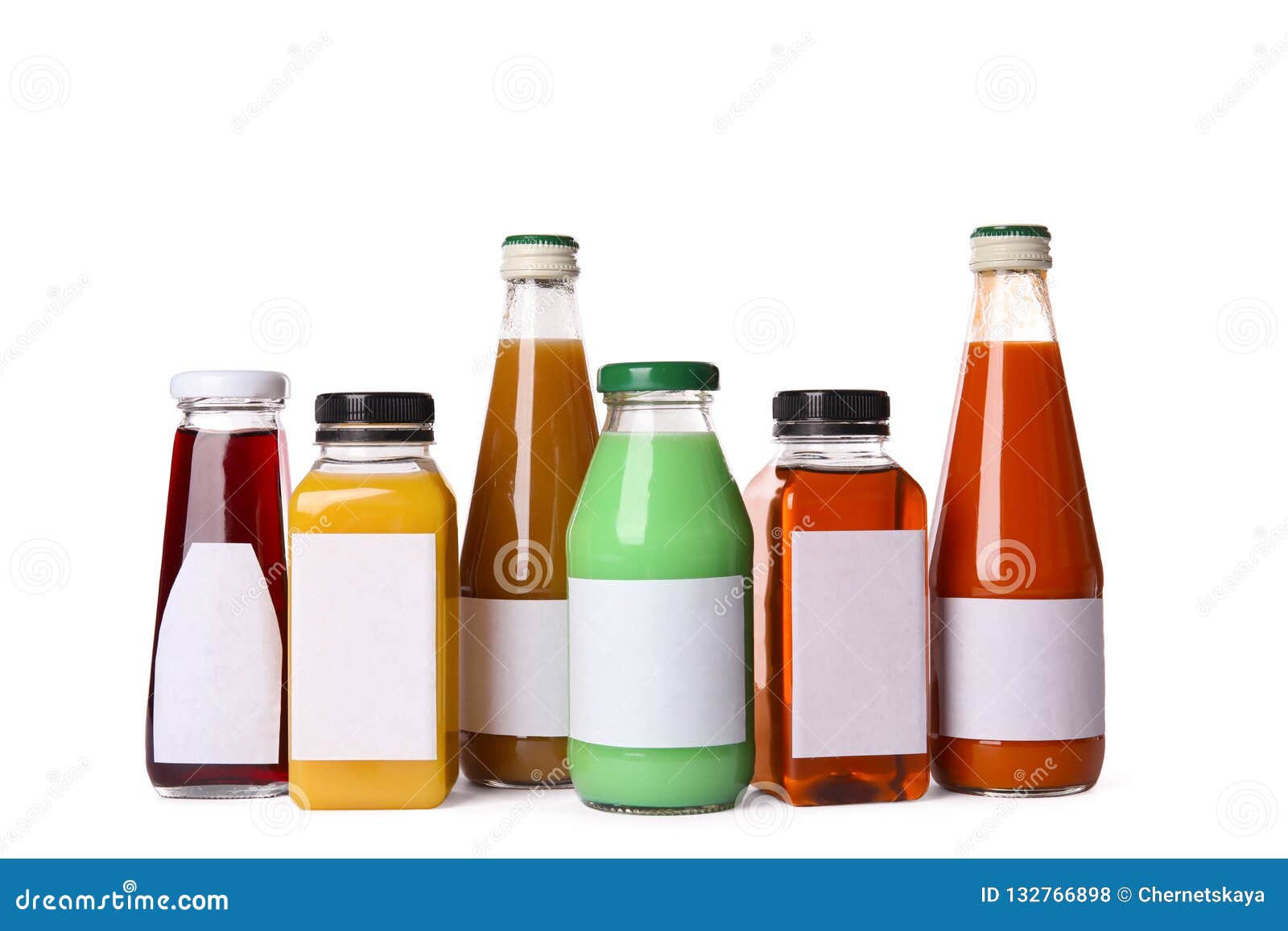 tasty drinks in bottles with blank labels on white background