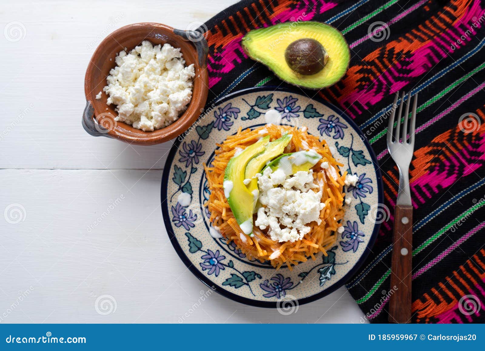 mexican fideos dry soup with avocado and cheese