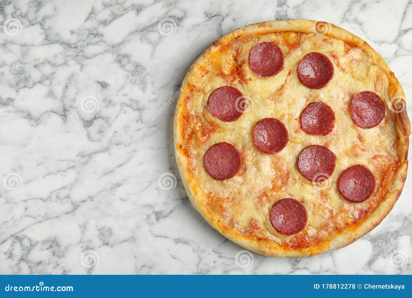 Tasty Pepperoni Pizza on White Marble Table. Space for Text Stock Photo