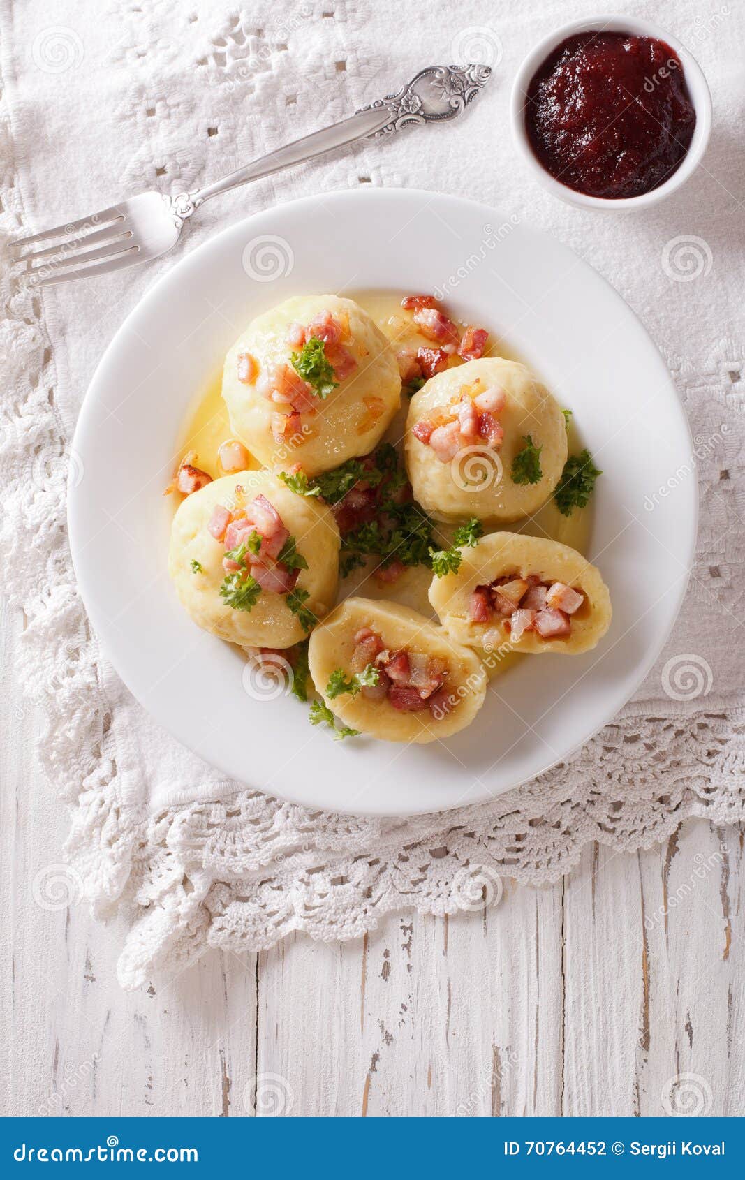 tasty potato dumplings with bacon and parsley topped with butter