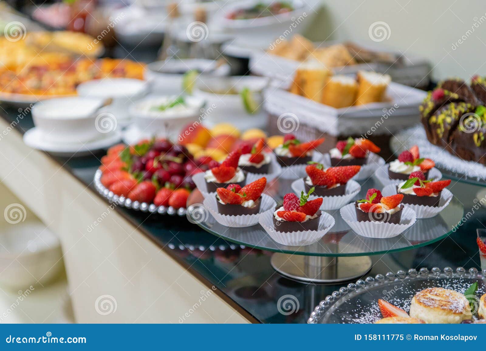 A Tasty Sweet Dessert with Creme and Strawberries on a Breakfast Buffet