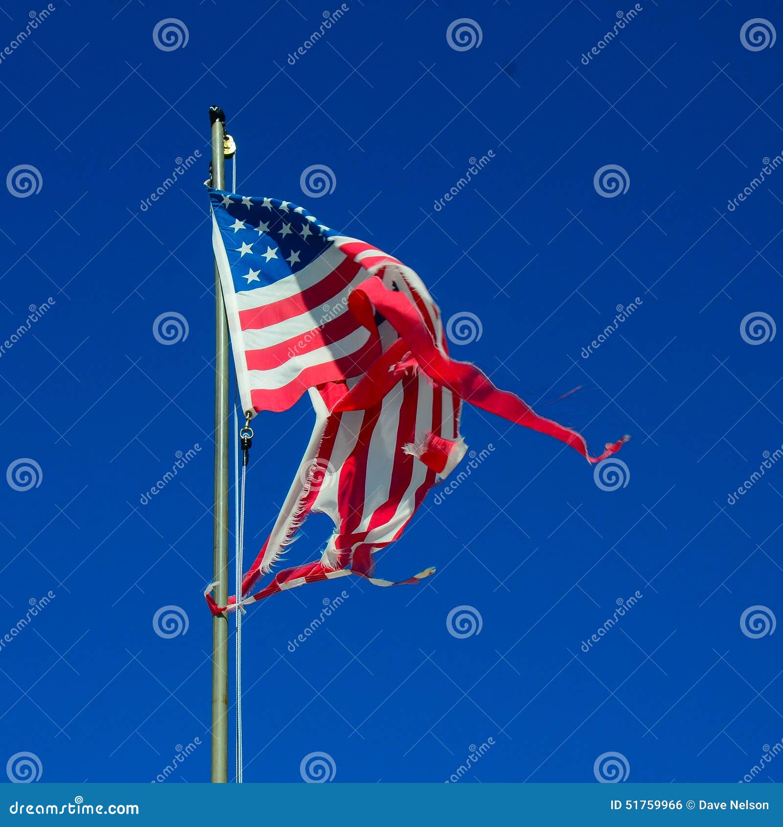 tattered-twisted-american-flag-worn-shredded-flapping-wind-51759966.jpg