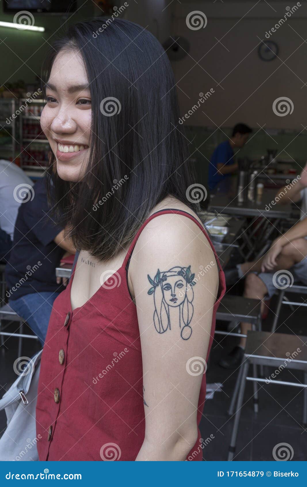 Portrait Of A Young Asian Fashion Designer With Many Tattoos