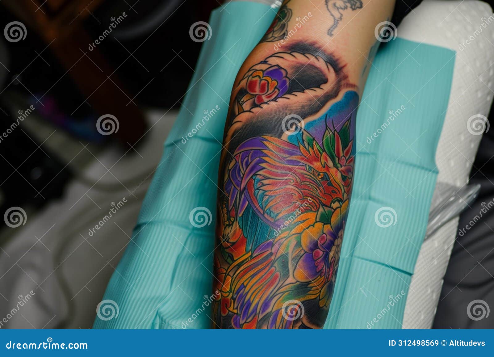tattoo inprogress on a forearm, with vibrant colors