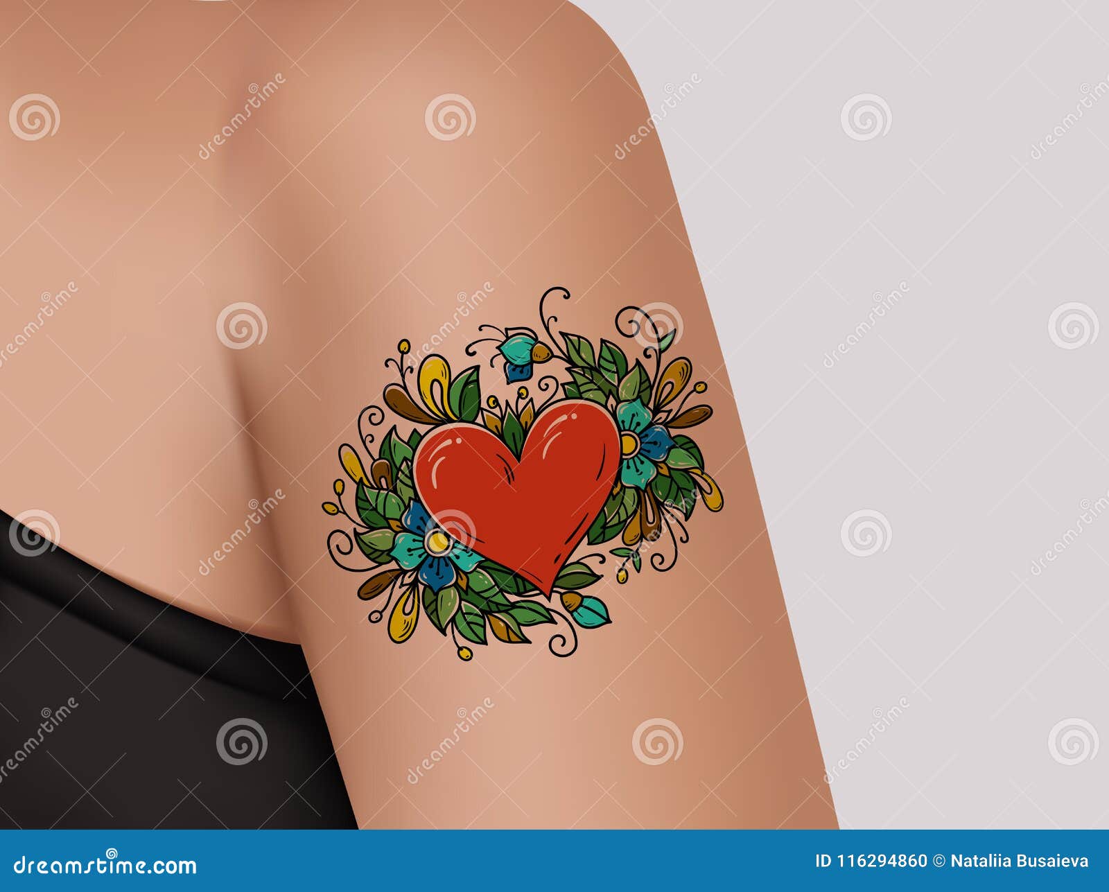 tattoo on shoulder. heart decorated with flowers