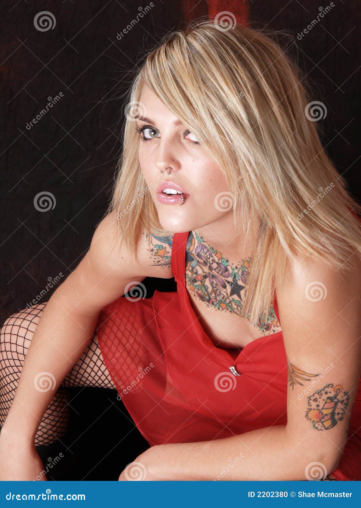 Sassy tattooed blonde
