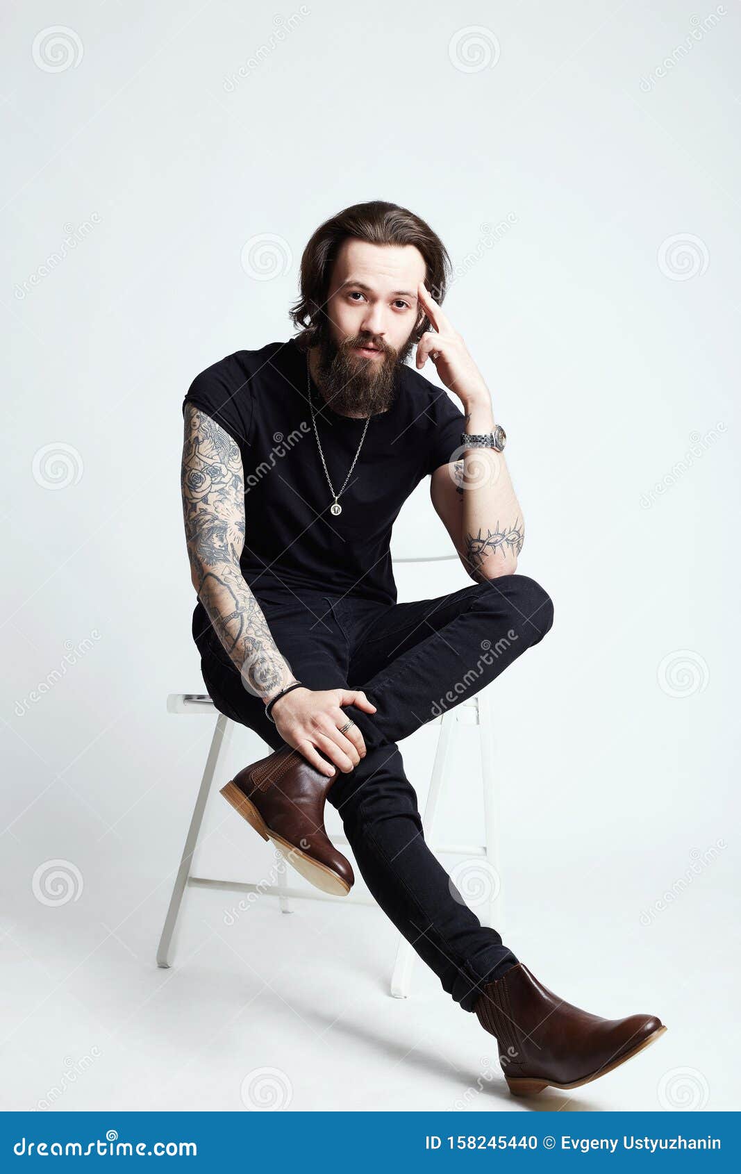 Tattooed Handsome Man Sitting on a Chair Stock Photo - Image of cool ...