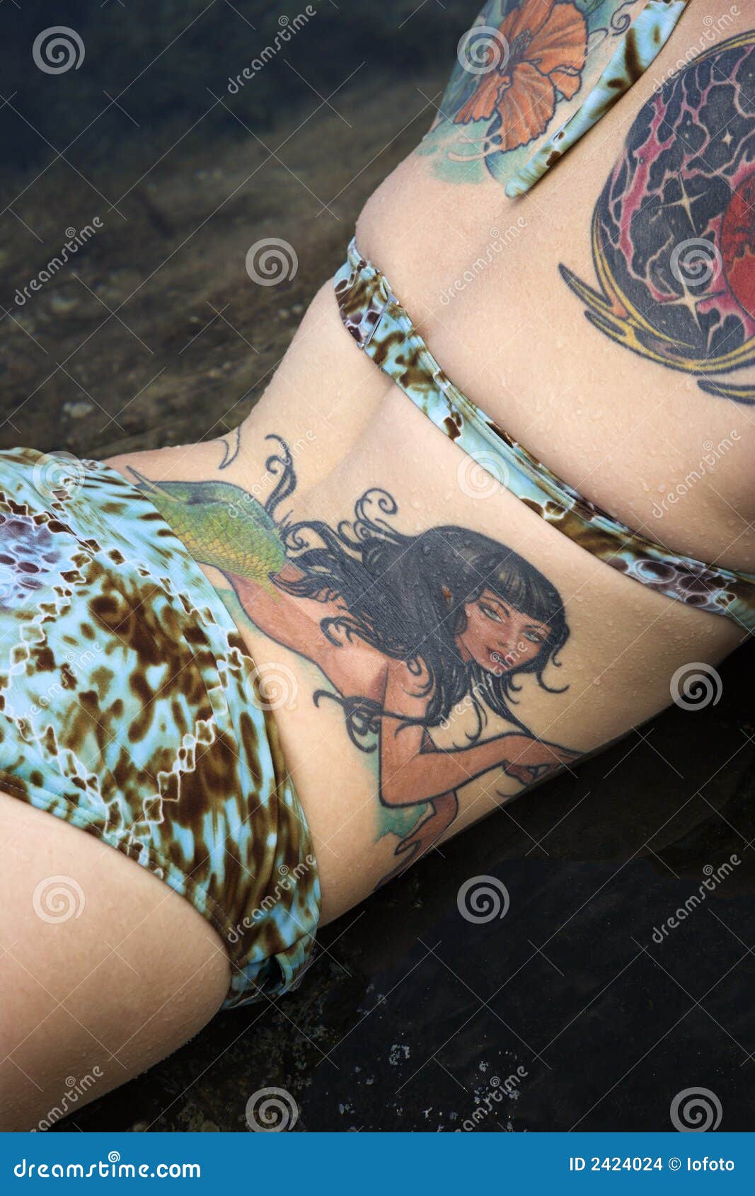 Tattooed woman in bikini. stock photo. Image of body, exotic - 2424024