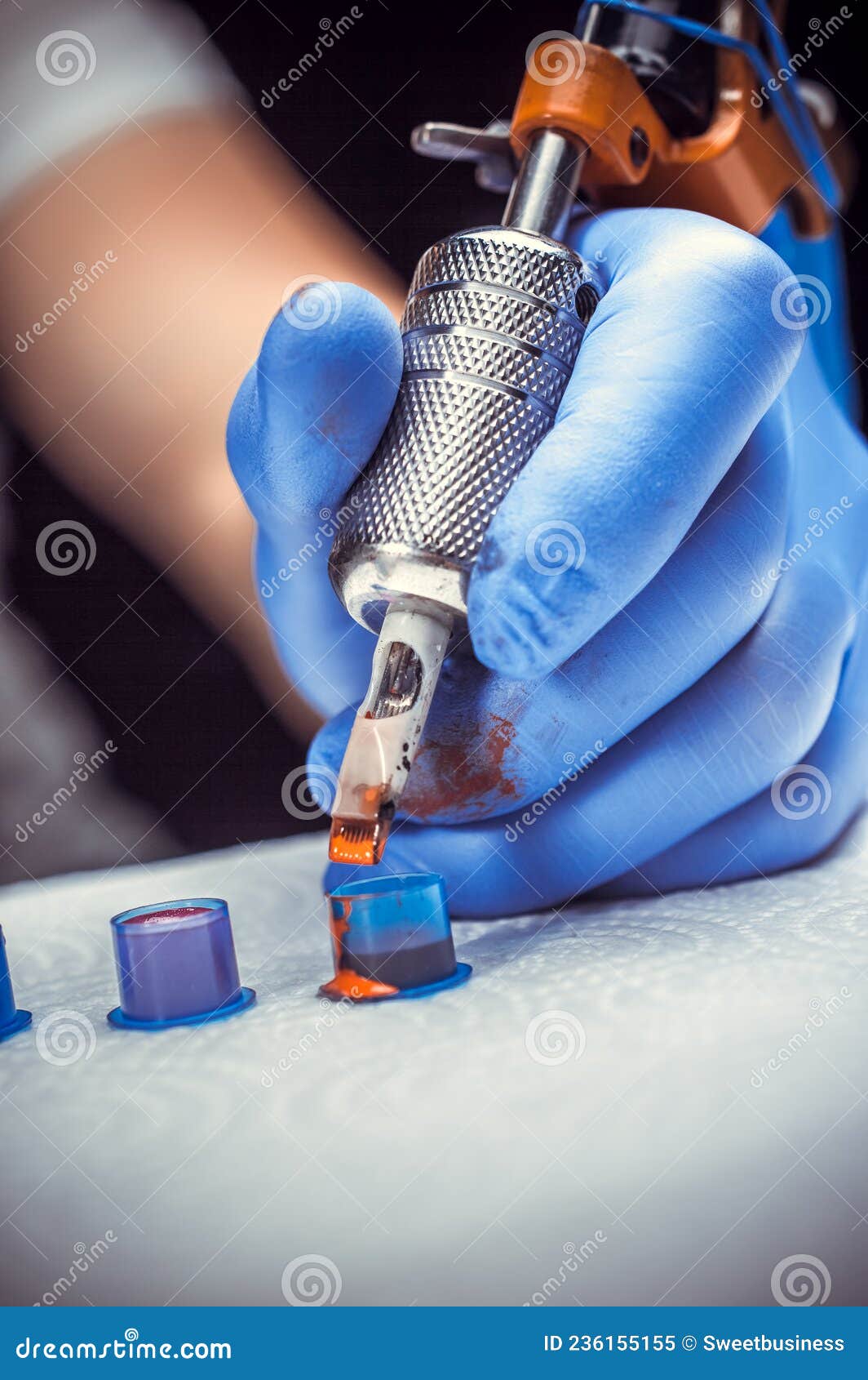 Tattooer& X27;s Hand and a Tattoo Machine. Stock Image Image of
