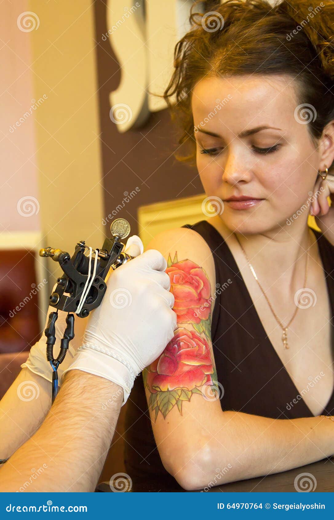 Tattooer Showing Process of Making a Tattoo on Young Beautiful Hipster Woman with Red Curly Hair Arm. Tattoo Design in the Form of Stock Photo - Image of gothic, gloves: 64970764